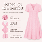 Damklänning med bågformad v-ringning och hålsömmar